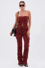 IT GETS EASIER STACKED CARGO PANT IN BURGUNDY